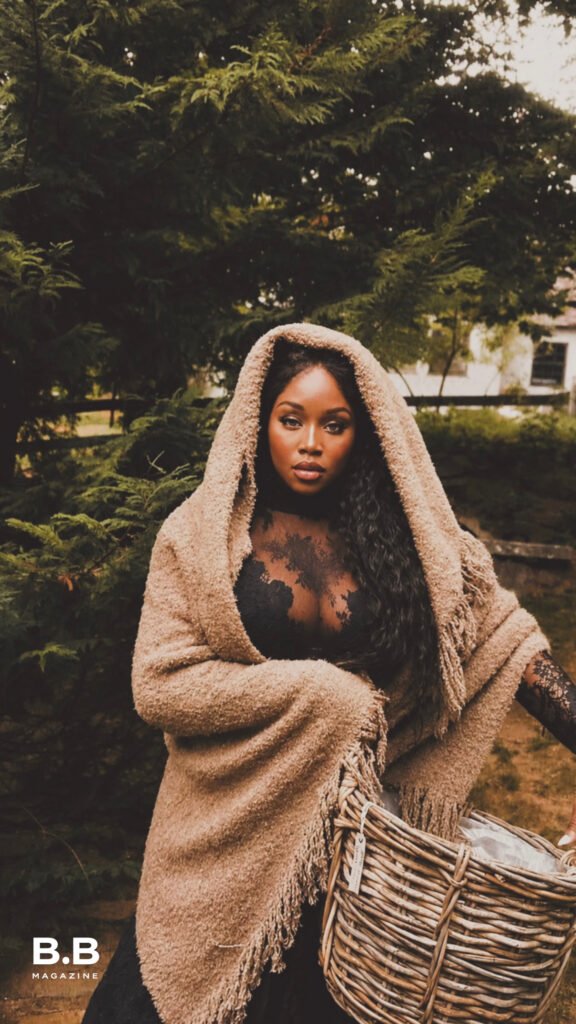 Woman in black lace gown and cream shawl carrying woven basket in Ethereal Woman Fall Winter 2026 story